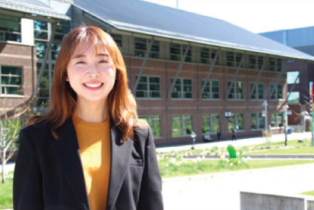 Smiling female student in a blazer